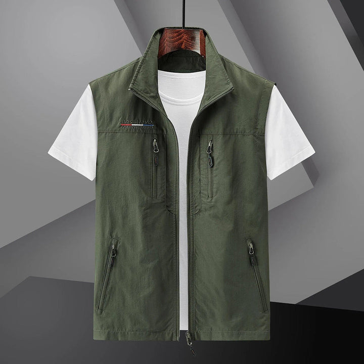 Lightweight men's adventure vest with secure zip pockets, essential outdoor gear for hiking, travel & fishing.