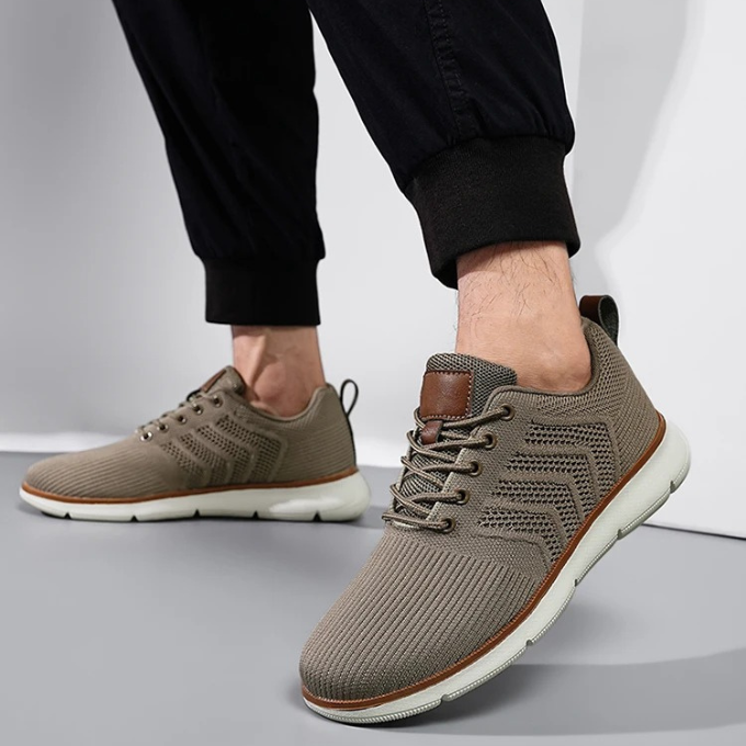 Close-up of breathable Airmesh upper on men's lightweight athletic sneakers, ensuring maximum airflow.