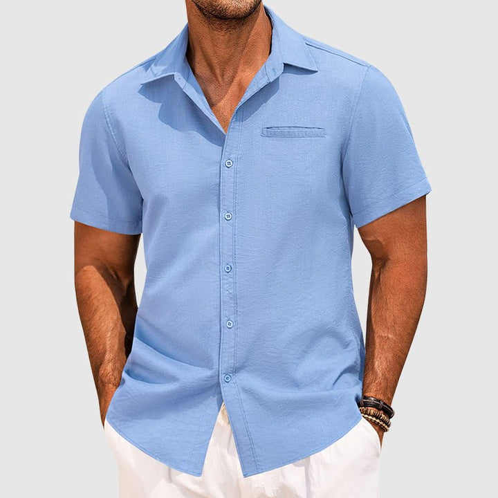 Lightweight men's summer shirt, short sleeve button-down with chest pocket. Breathable fabric for hot weather.