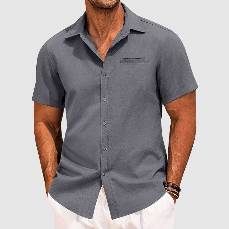 Versatile men's summer shirt, short sleeve button-down. Features lapel collar & chest pocket. Great for relaxed style.