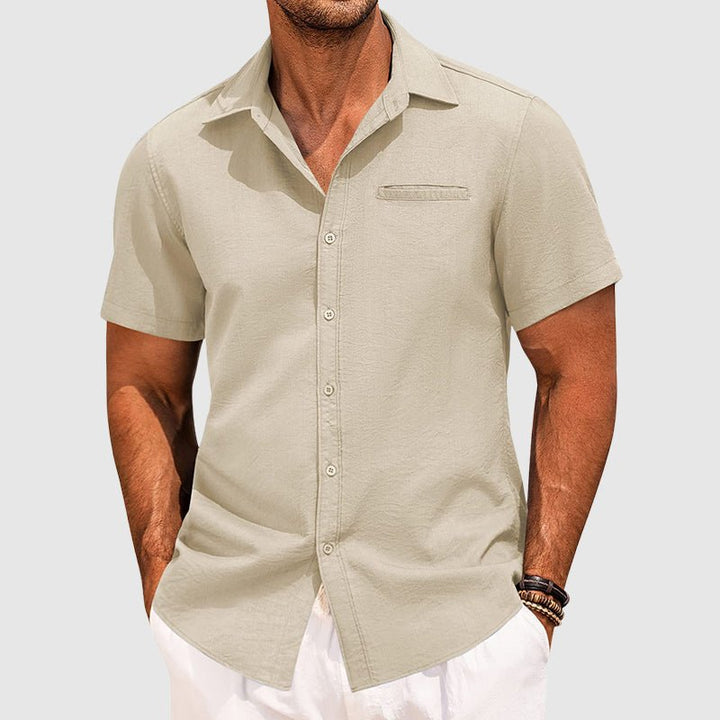 Men's button-down short sleeve shirt with a lapel collar. Lightweight summer top, great for warm casual occasions.