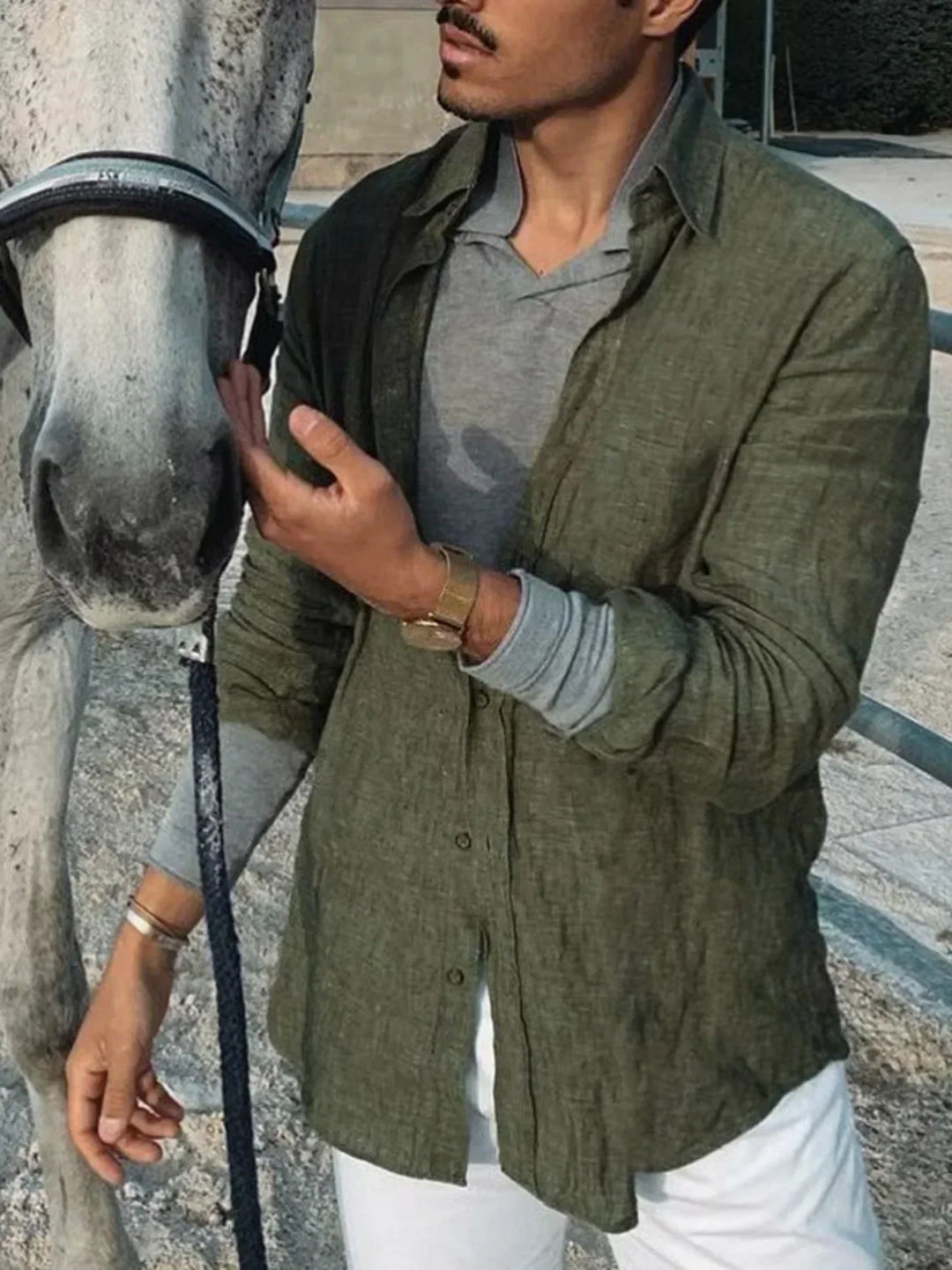 Versatile men's casual button-down shirt. Lightweight linen, long sleeves rolled up for warm weather style.