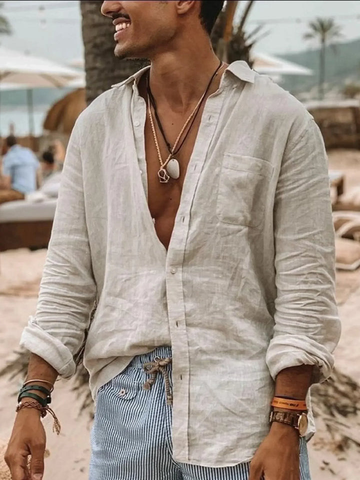 Men's relaxed fit button-up linen shirt. Lightweight, long roll-up sleeves for casual summer comfort.