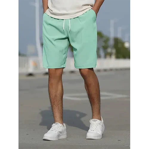 Men's high-waist shorts in a lifestyle setting. Perfect for casual summer wear & comfortable everyday style.