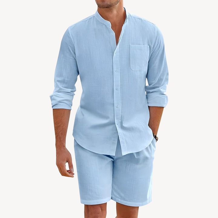 Lightweight men's summer set featuring a breathable button-up shirt and comfortable drawstring shorts. Casual fashion.