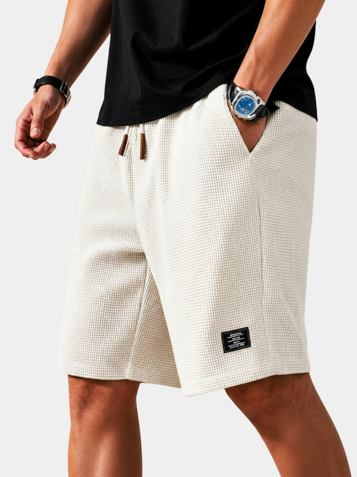 Men's lightweight summer shorts with drawstring waist, perfect for casual comfort & warm weather.