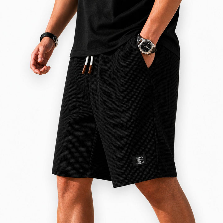 Versatile men's casual shorts with elastic waist, great for travel & ultimate summer comfort.