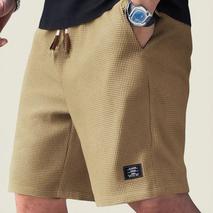 Men's drawstring shorts for summer, offering a relaxed fit and all-day comfort for various activities.