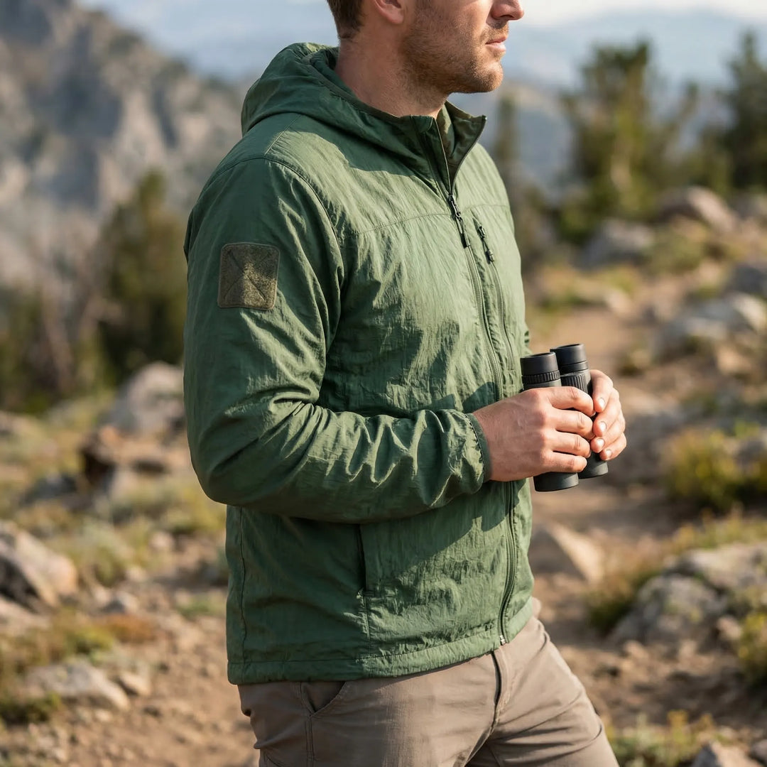 Men's lightweight tactical windbreaker jacket with hood, ideal for outdoor hiking and travel. Quick-dry.