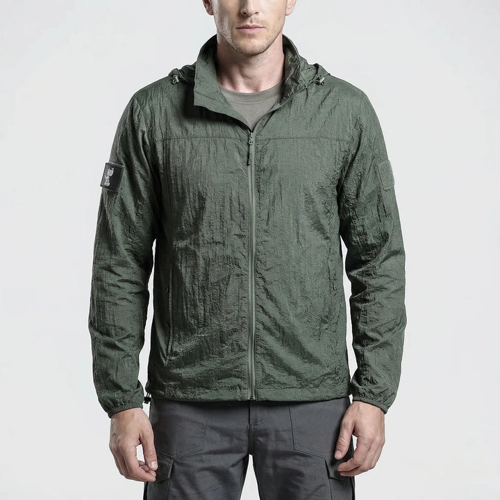 Hooded men's tactical windbreaker jacket, lightweight and quick-dry, perfect for hiking and outdoor activities.