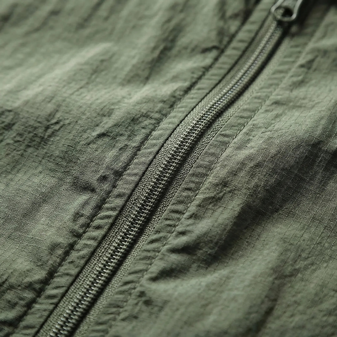 Quick-dry men's lightweight windbreaker jacket, tactical design for outdoor hiking and comfortable travel.