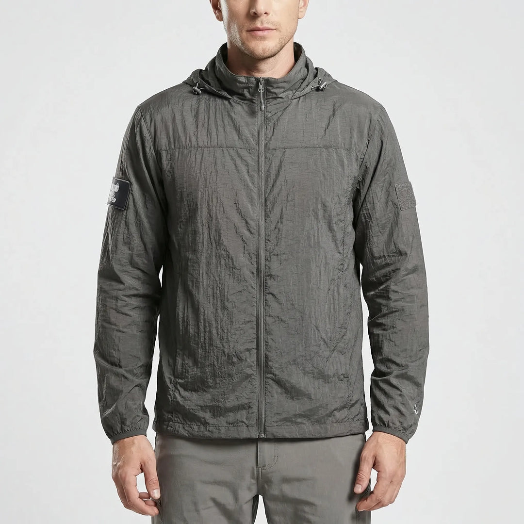 Back view of men's lightweight hooded tactical windbreaker jacket, quick-dry and durable for outdoor adventures.
