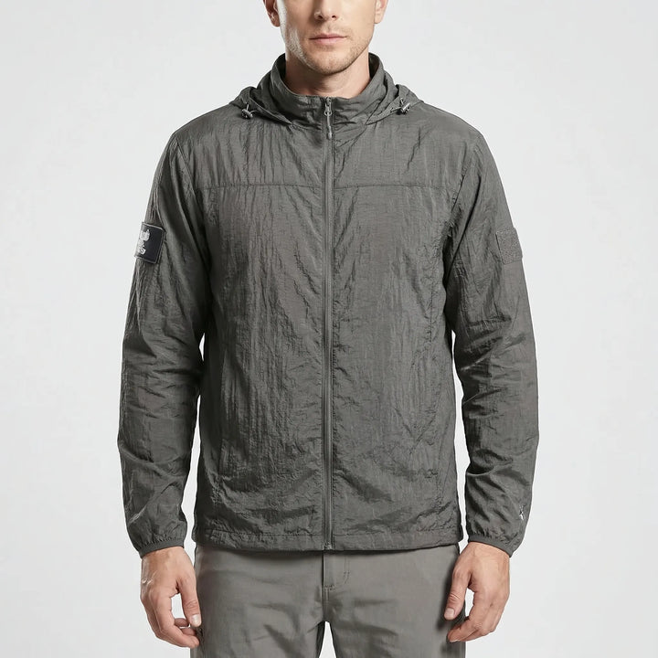 Back view of men's lightweight hooded tactical windbreaker jacket, quick-dry and durable for outdoor adventures.