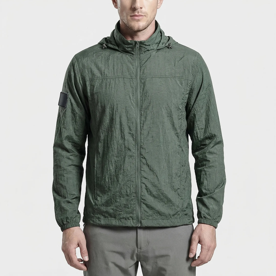 Compact, lightweight men's tactical windbreaker jacket with hood, essential quick-dry gear for travel & hiking.