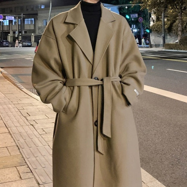 Men's tailored long overcoat with a cinched belt, offering a sophisticated and classic trench coat look.