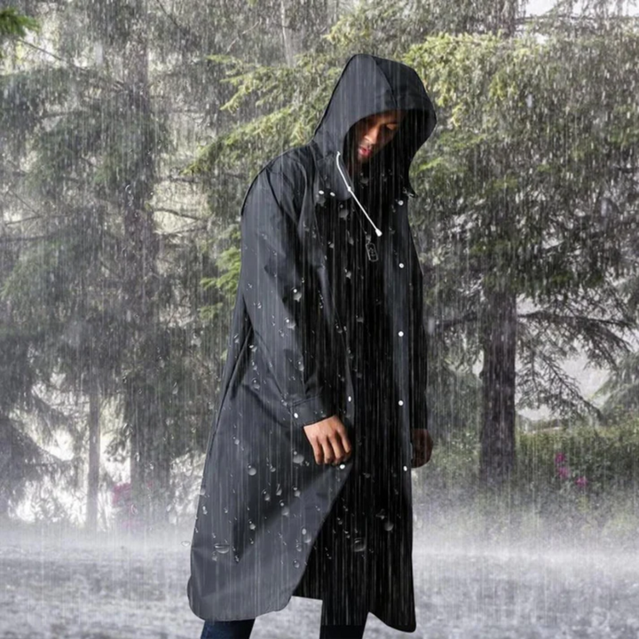 Stylish men's hooded waterproof long black raincoat, perfect for travel, all-weather gear, and urban fashion.