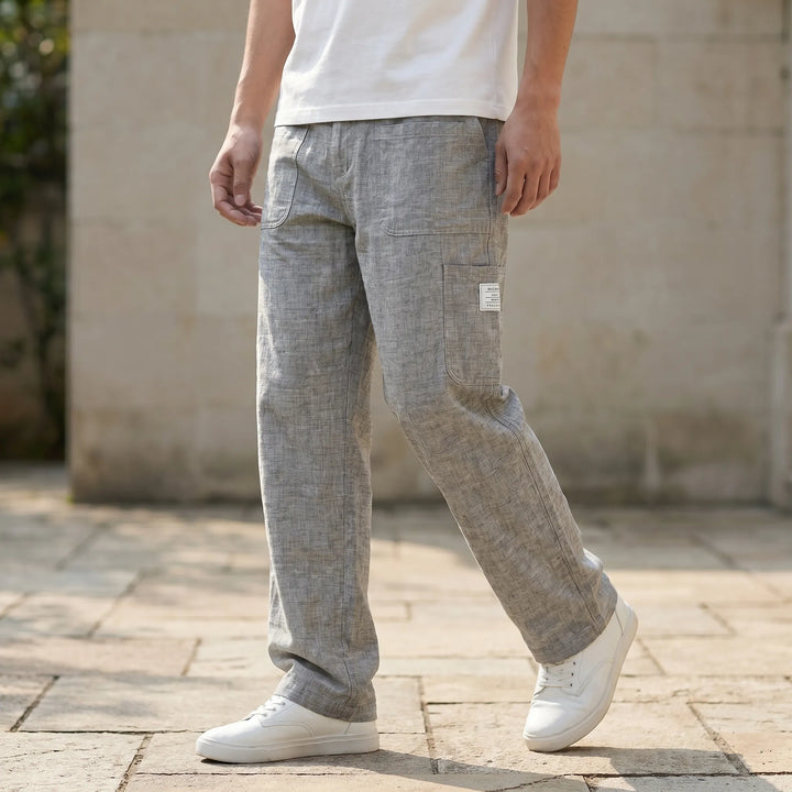Men's loose straight-leg cargo pants with drawstring waist. Ideal for casual wear & ultimate comfort.