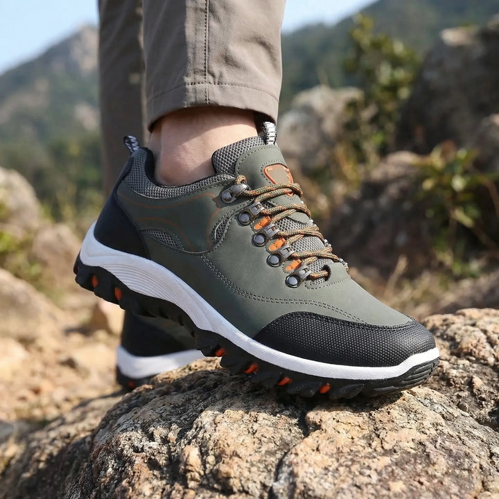 Men's low-cut waterproof hiking shoes for all-terrain trails, offering durability and comfort.