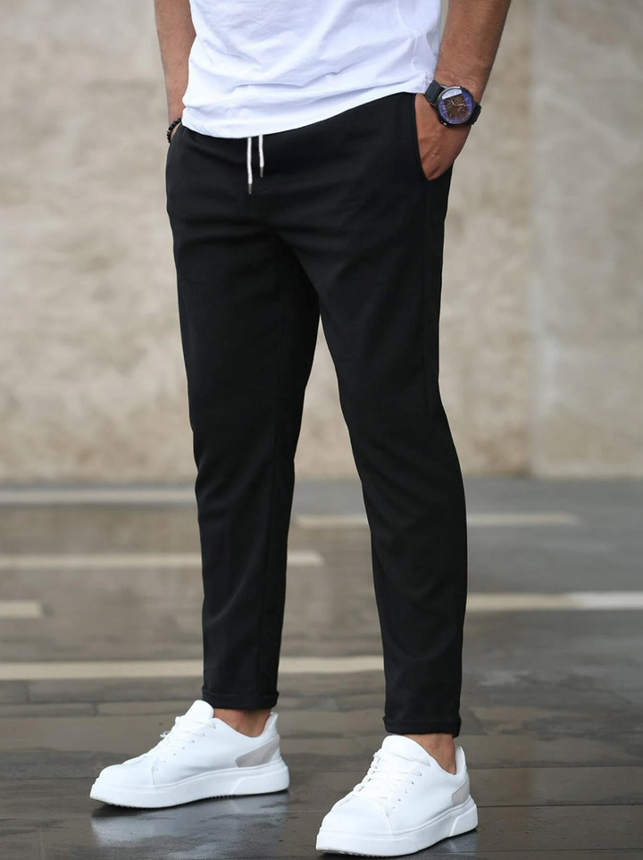 Premium men's stretch trousers with a comfortable drawstring waist for versatile wear.