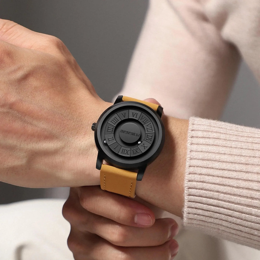 Elegant men's magnetic watch featuring a black leather strap & unique sphere-based time display.