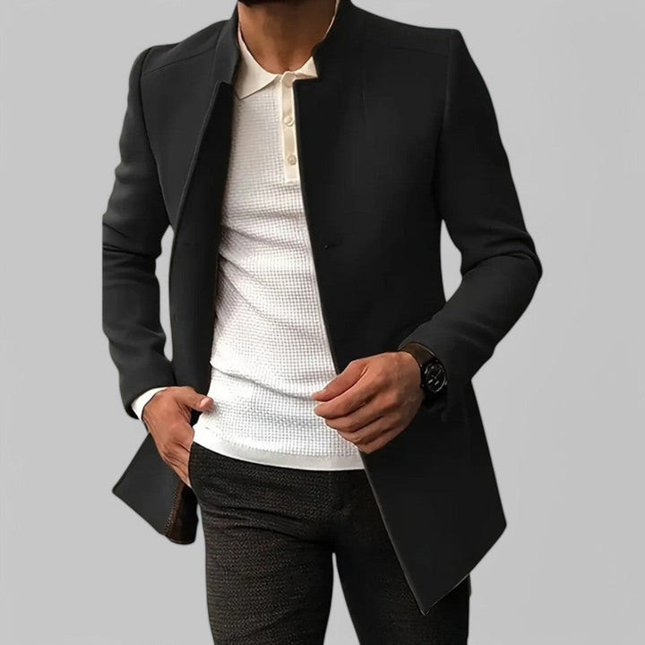 Smart casual men's minimalist winter outerwear, buttoned and tailored for elegant cold weather.