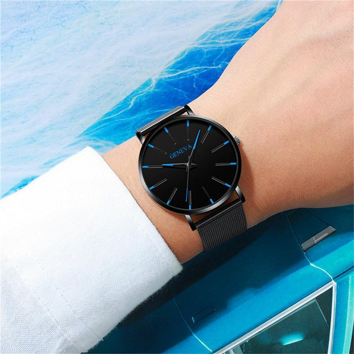 Sleek men's fashion watch, a minimalist design with striking blue details. A versatile quartz timepiece accessory.