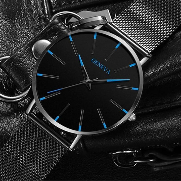 Essential men's fashion accessory: a minimalist quartz watch with bold blue accents, elevating any outfit.
