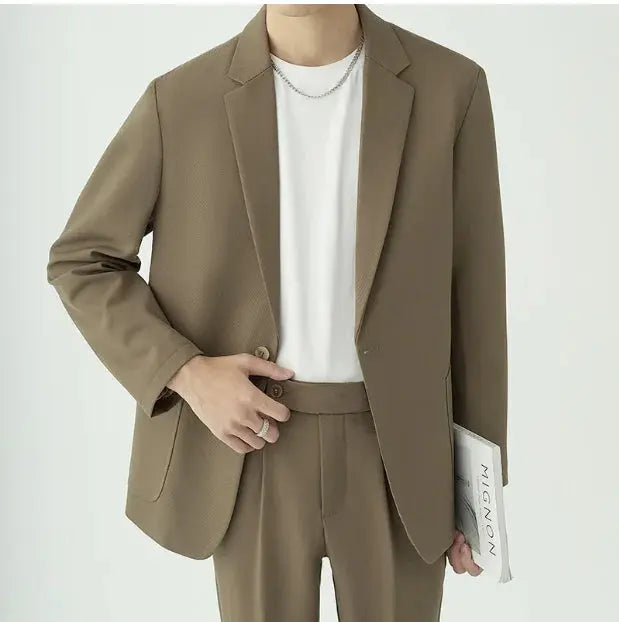 Men's modern minimalist two-piece suit, tailored for formal wear & business attire. Sophisticated look.