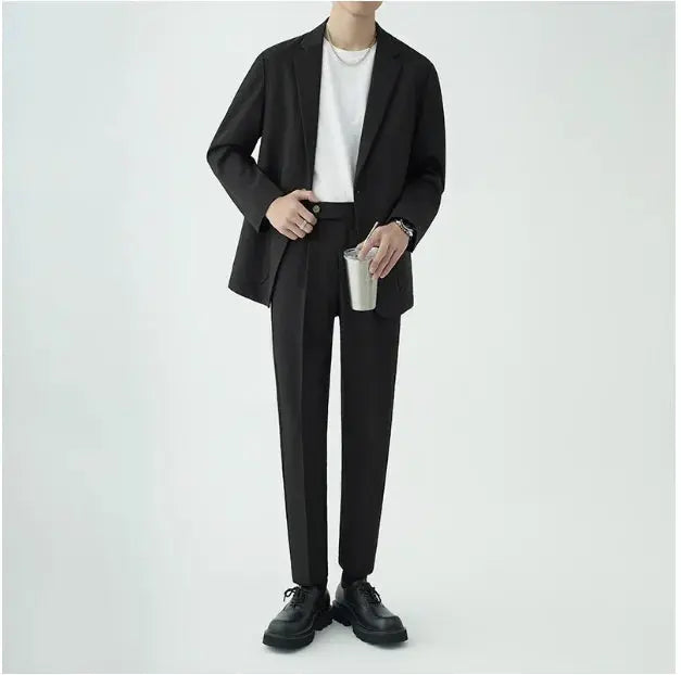 Minimalist men's suit for special occasions, business attire, or sophisticated formal wear; a tailored fit.