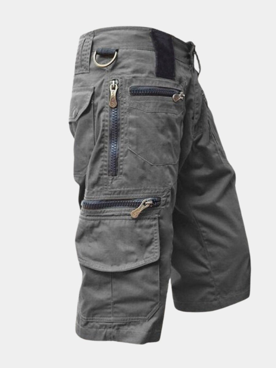 Men's multi-pocket cargo shorts in khaki, ideal for outdoor adventures & travel. Comfortable utility design.