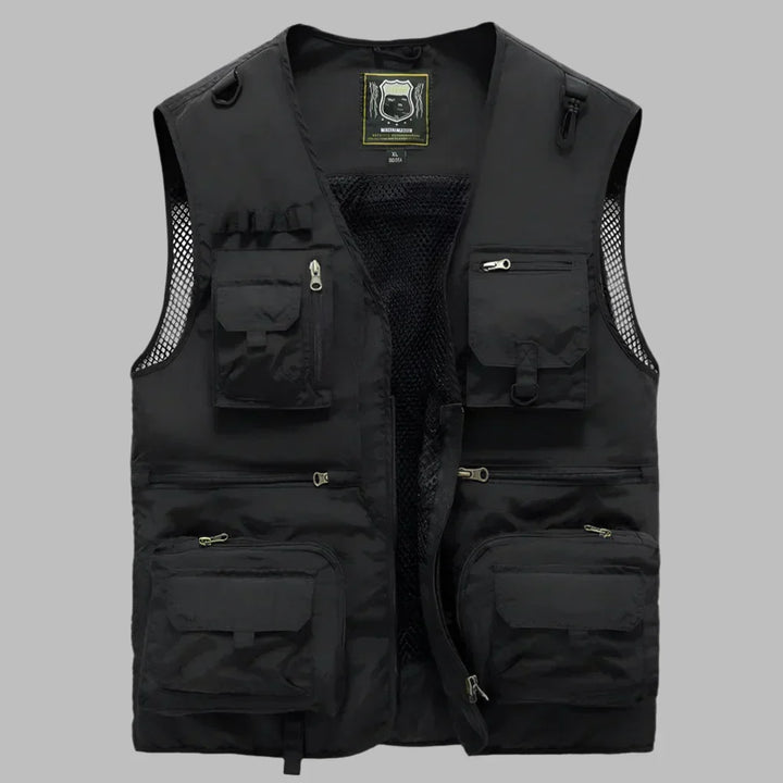 Sleeveless men's fishing vest with multiple pockets for tackle, bait, and gear. Durable outdoor hiking apparel.