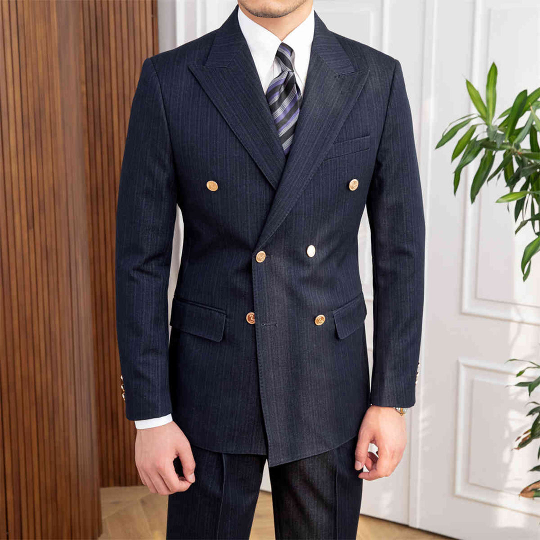 Men's navy blue slim fit double-breasted suit, ideal for formal business wear or wedding attire. Tailored classic style.