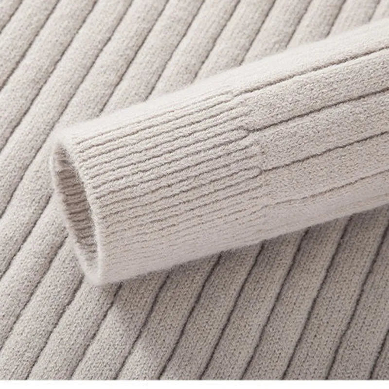 Refined men's half-zip sweater with a subtle ribbed texture, perfect for smart casual outfits.