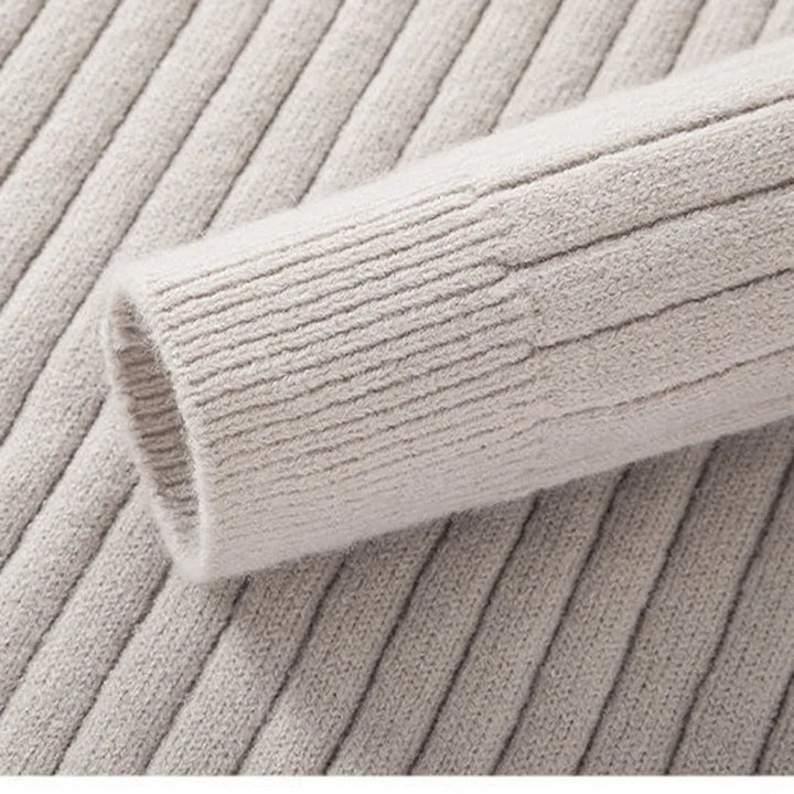 Refined men's half-zip sweater with a subtle ribbed texture, perfect for smart casual outfits.