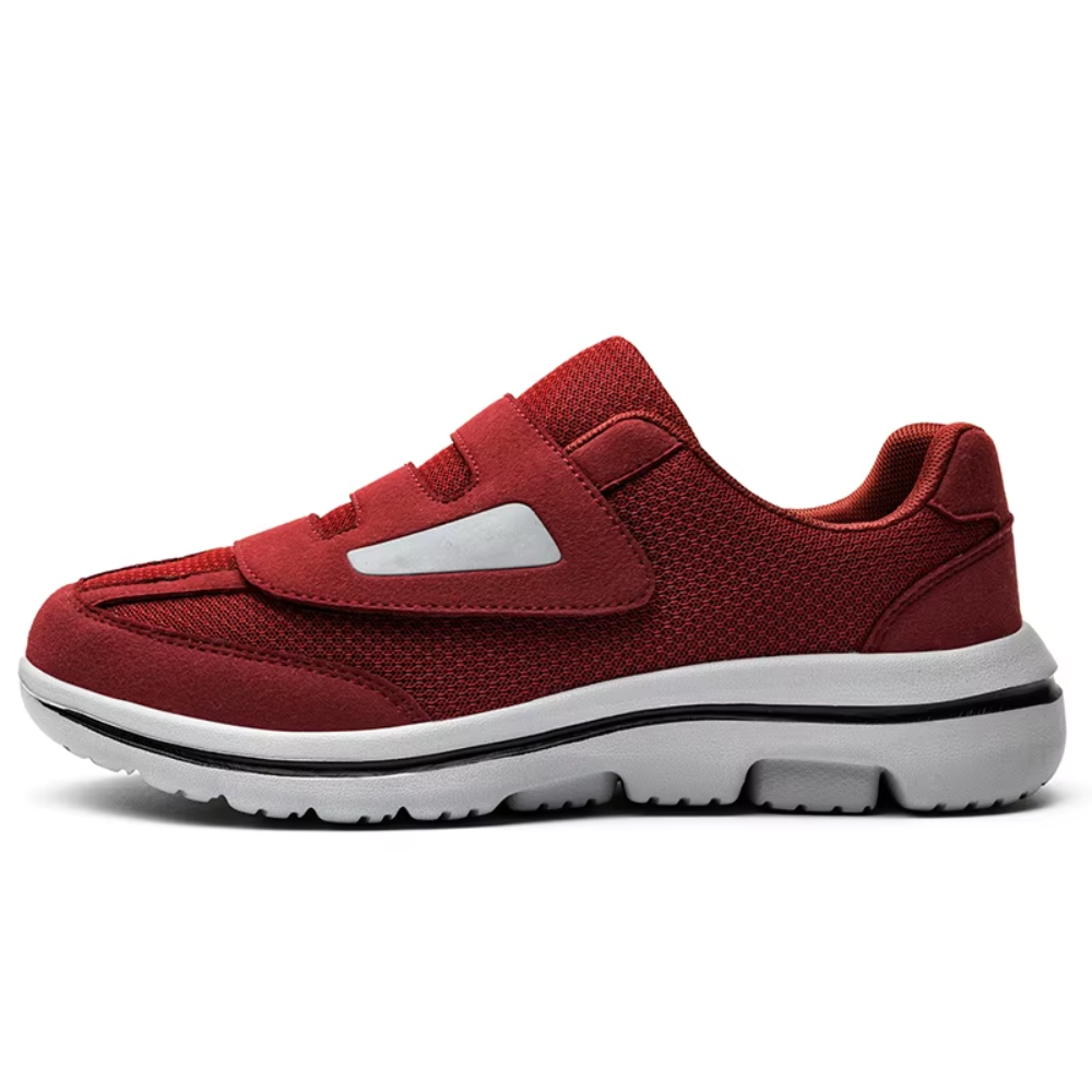 Side view of grey men's orthopedic shoes, showing a supportive sole and adjustable strap for a secure fit.