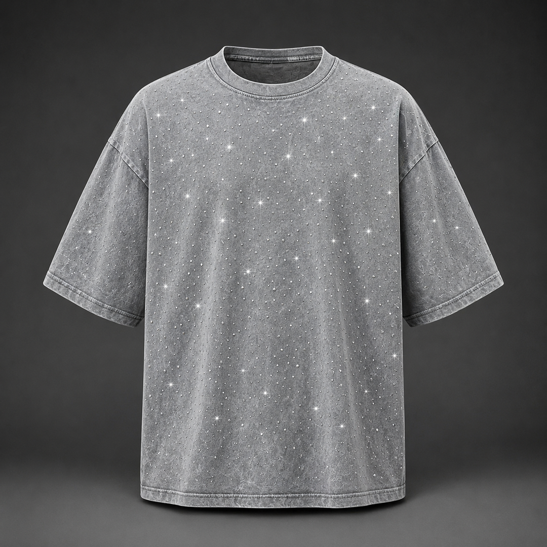 Detailed shot of the soft washed fabric and shimmering rhinestones on a men's casual t-shirt.