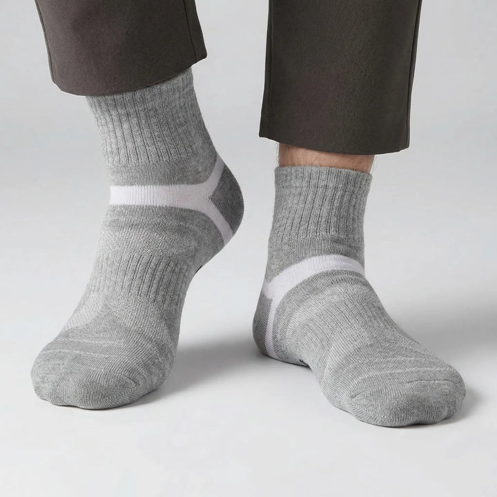 Multi-pack men's athletic ankle socks, essential activewear for diverse sports and workouts.