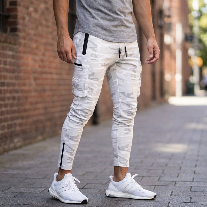 Men's Performance Joggers: Black athletic pants with secure zip pockets & tapered fit for gym & active lifestyle.