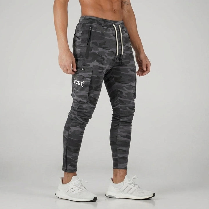 Black men's workout gear joggers, designed with secure pockets and a comfortable fit for an active lifestyle.