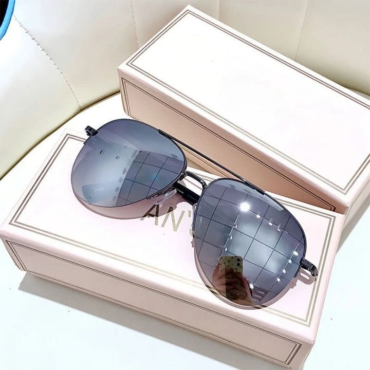 Angled view of trendy men's pilot sunglasses. Gradient lenses and UV400 protection for stylish eyewear.