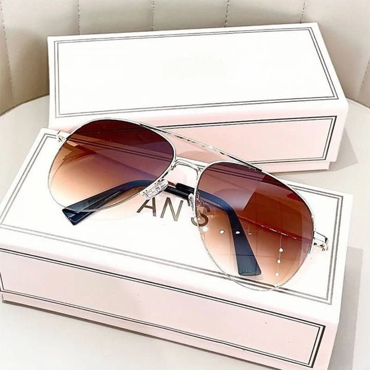 Close-up of gradient lenses on men's pilot sunglasses, offering UV400 protection & trendy eyewear.