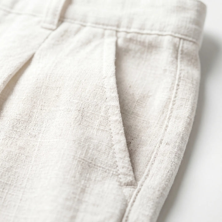 Comfortable men's pleated pants, versatile smart casual trousers for warm weather. Relaxed fit menswear.
