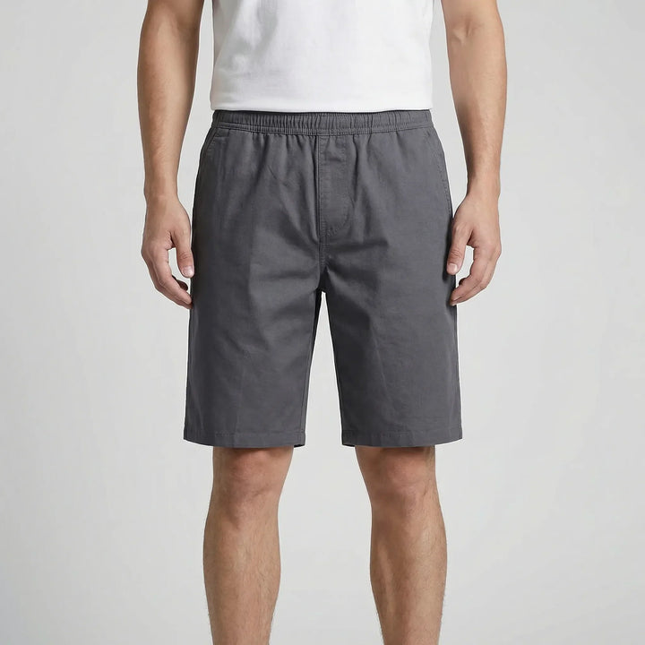 Relaxed fit plus size men's shorts. Knee-length, comfortable, with elastic waist for casual and summer wear.