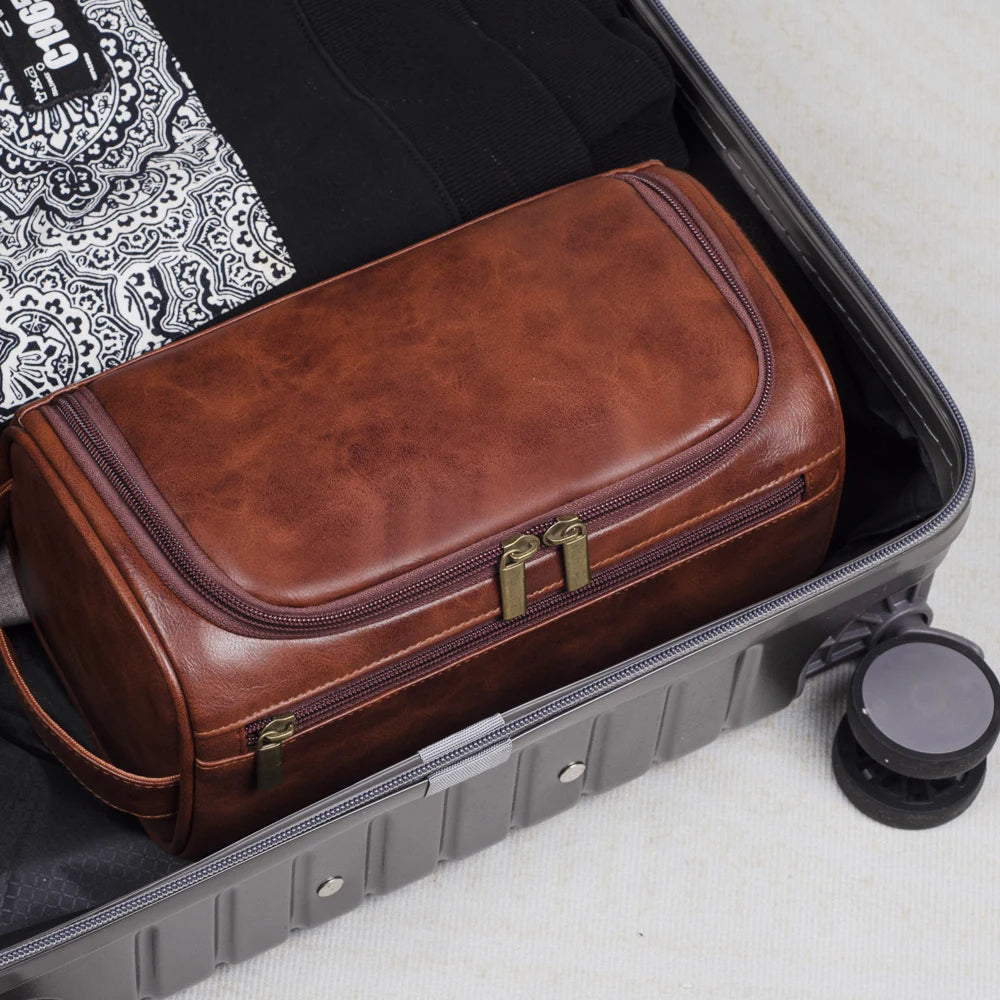 Dark brown luxury men's toiletry bag, a waterproof dopp kit for travel & grooming organization.