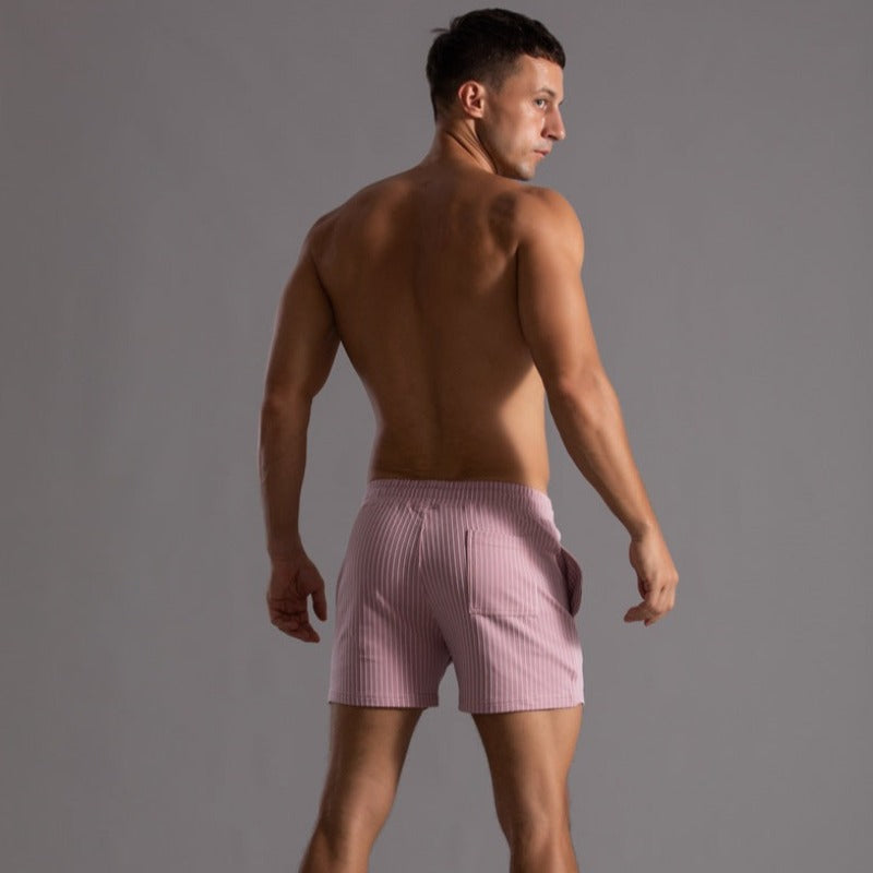 Sporty quick-dry men's swim trunks. Durable ripstop fabric, perfect for active beach days.