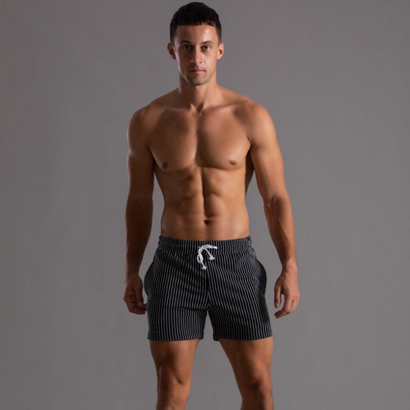 Men's quick-dry swim trunks. Modern design, ripstop polyester. Great for beachwear & pool.