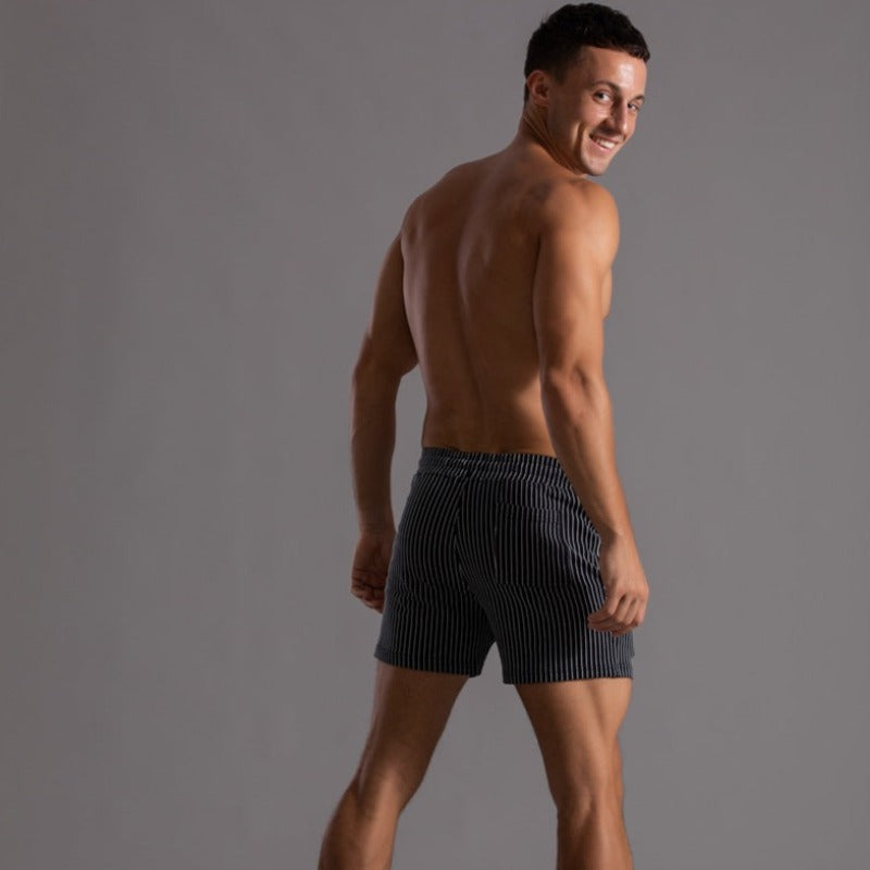 Vacation essential: men's quick-dry swim trunks. Stylish, sporty, and comfortable for beach & pool.