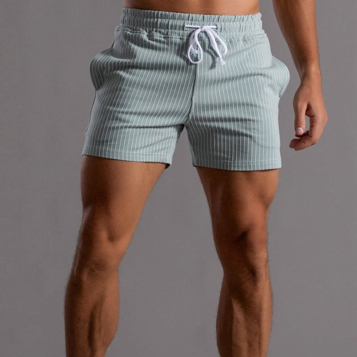 Quick-dry ripstop men's swim shorts. Athletic fit, perfect for summer beach and pool activities.