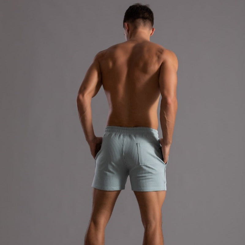 Men's quick-dry swim trunks for beach & pool. Durable ripstop material, summer fashion essential.