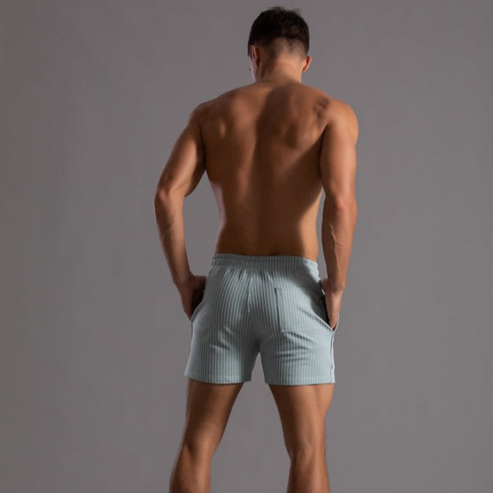 Men's quick-dry swim trunks for beach & pool. Durable ripstop material, summer fashion essential.
